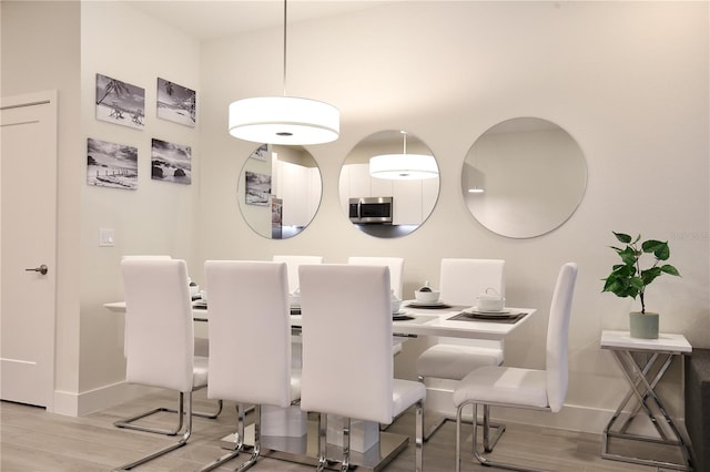 dining space featuring light hardwood / wood-style flooring