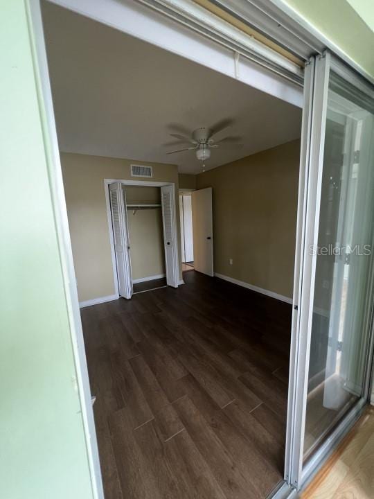 interior space with dark hardwood / wood-style floors