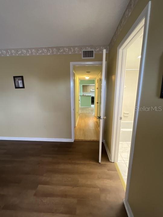 hall featuring wood-type flooring