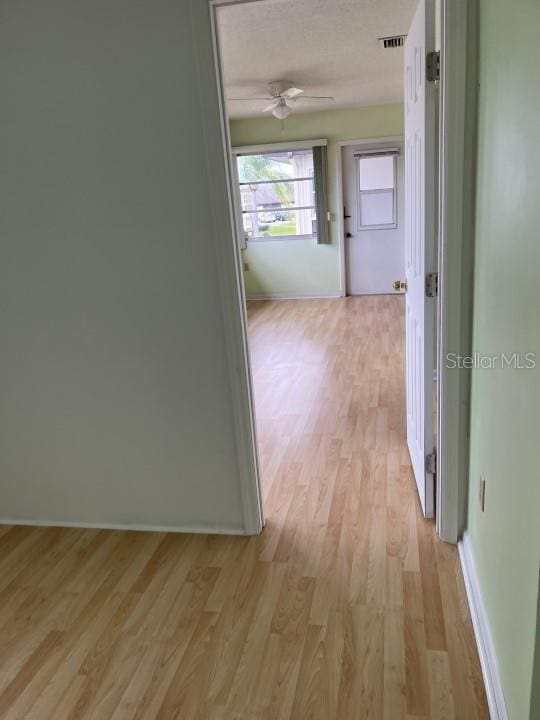 hallway featuring light hardwood / wood-style flooring