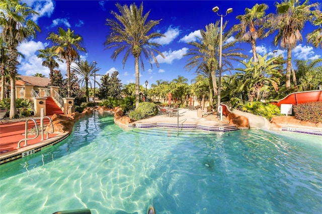 view of pool featuring a water slide