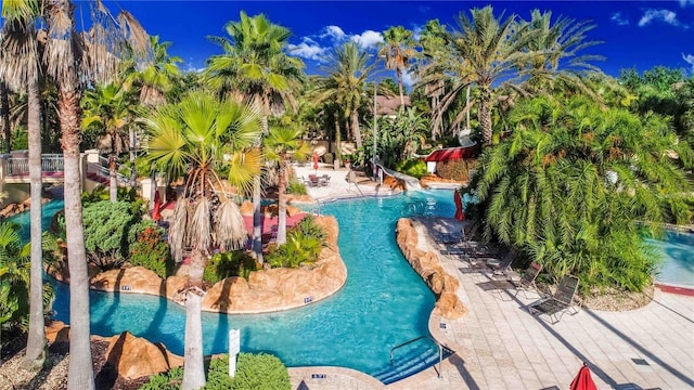 view of pool featuring a water slide