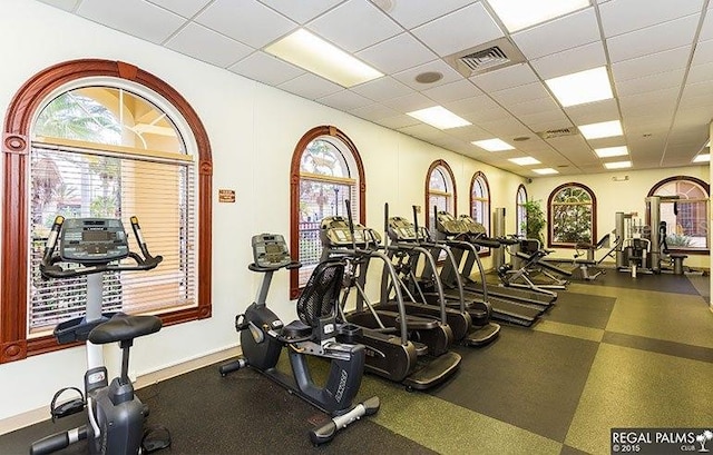 workout area with a paneled ceiling