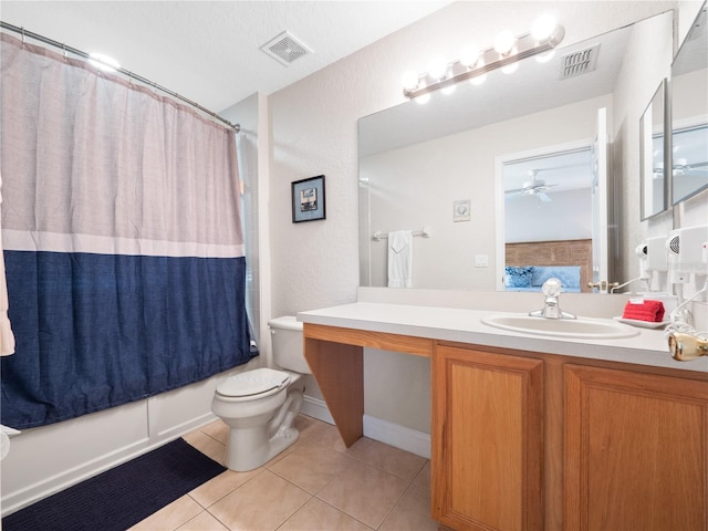 full bathroom featuring ceiling fan, vanity, shower / bath combination with curtain, tile patterned floors, and toilet