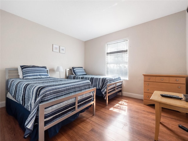 bedroom with hardwood / wood-style floors