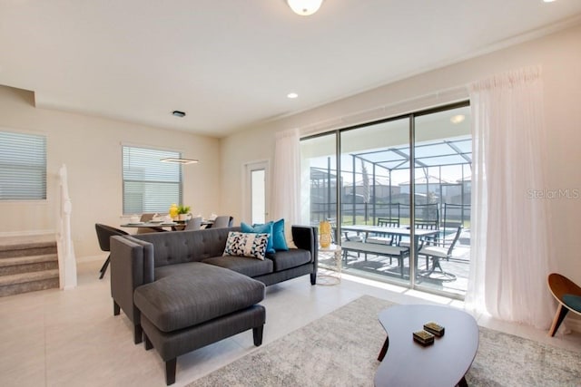 living room with light tile flooring and a wealth of natural light