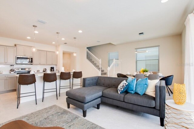 living room featuring light tile floors