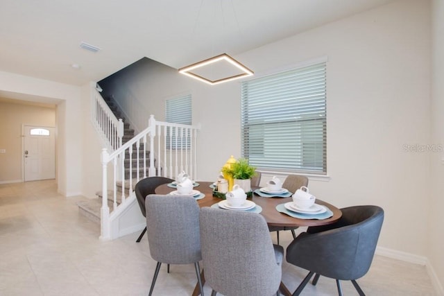 dining room featuring light tile floors