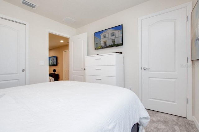 bedroom with light carpet