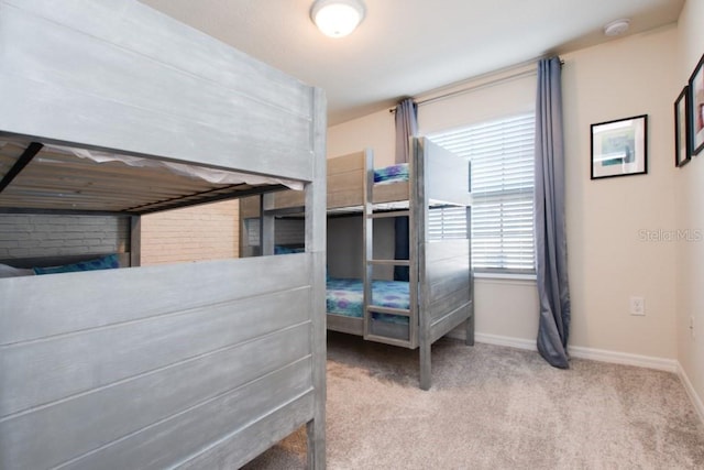 bedroom featuring light colored carpet