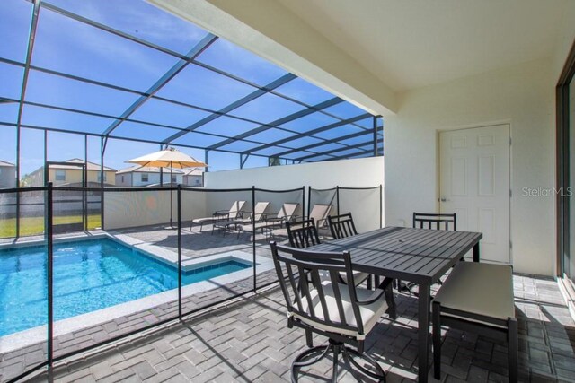 view of swimming pool with a patio