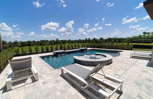 view of swimming pool with a patio area, an in ground hot tub, and pool water feature