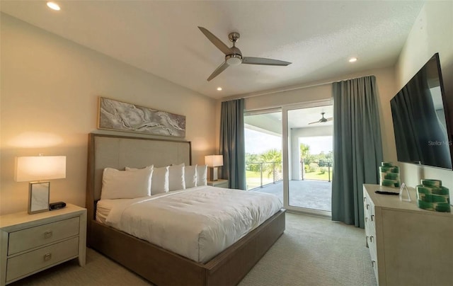 carpeted bedroom featuring access to exterior and ceiling fan