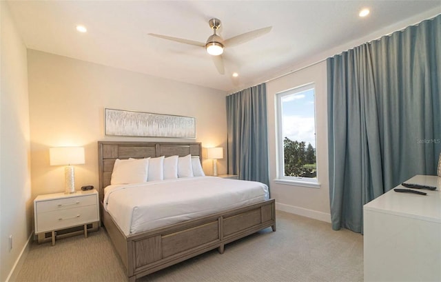 bedroom featuring light carpet and ceiling fan