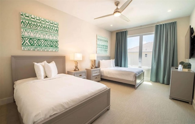 carpeted bedroom featuring ceiling fan