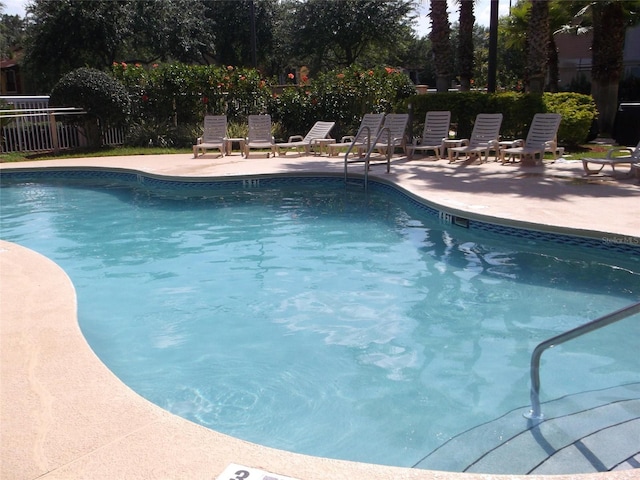 view of swimming pool featuring a patio area