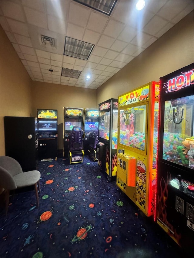 playroom with a paneled ceiling