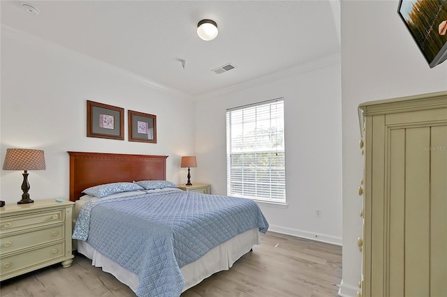 bedroom with light hardwood / wood-style flooring