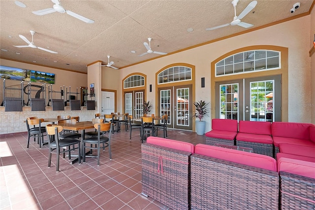 view of patio / terrace featuring ceiling fan, an outdoor living space, and french doors