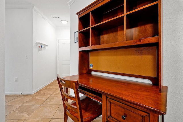 tiled office space with crown molding and built in desk