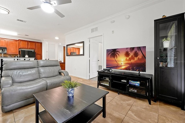 tiled living room featuring crown molding, a textured ceiling, and ceiling fan