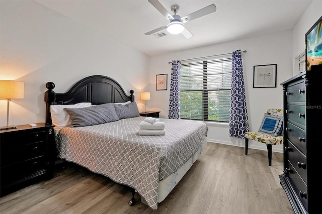 bedroom with ceiling fan and light hardwood / wood-style floors