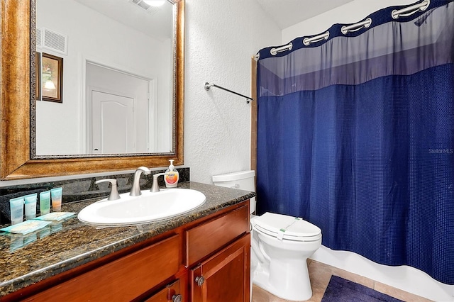 bathroom featuring vanity, tile patterned flooring, toilet, and a shower with shower curtain