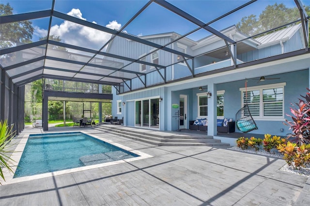 view of swimming pool with a lanai and a patio area