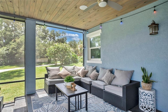 sunroom / solarium with ceiling fan and wooden ceiling