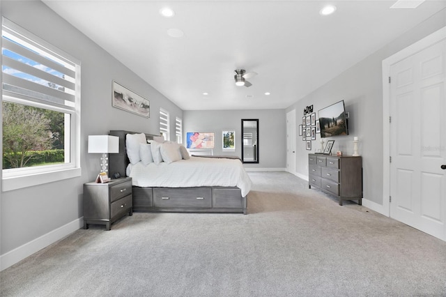 carpeted bedroom featuring multiple windows