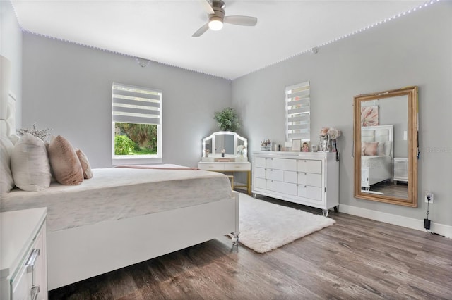 bedroom featuring hardwood / wood-style floors and ceiling fan