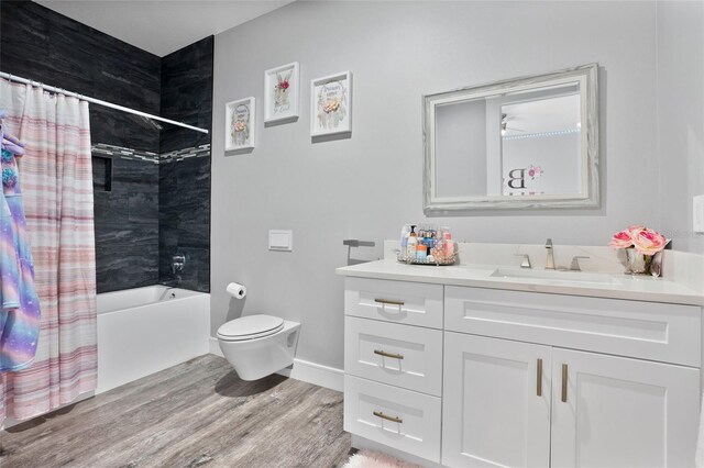 full bathroom featuring toilet, shower / bath combo with shower curtain, vanity, and hardwood / wood-style floors