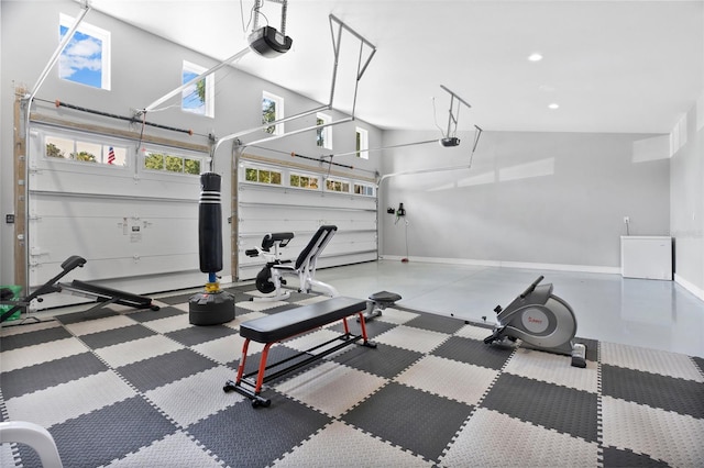 exercise room featuring a towering ceiling