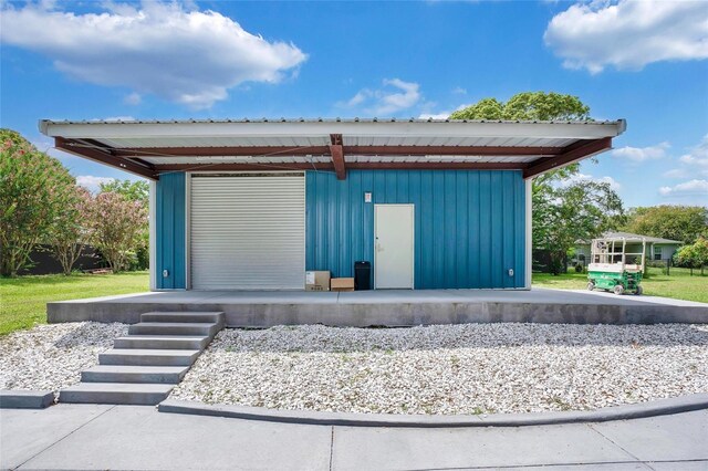 view of home's community with an outbuilding and a carport