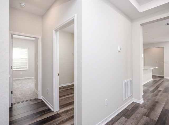 hallway featuring dark wood-type flooring