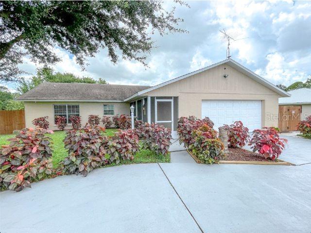 single story home with a garage