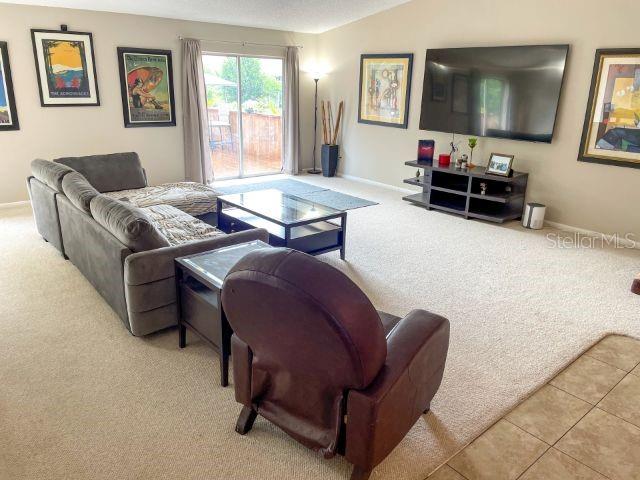living room with light tile flooring