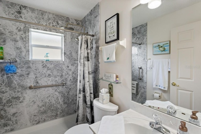 full bathroom with toilet, a textured ceiling, shower / bath combo with shower curtain, and sink