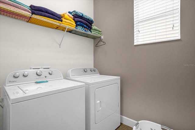 washroom with independent washer and dryer