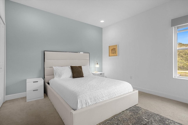 bedroom with light colored carpet