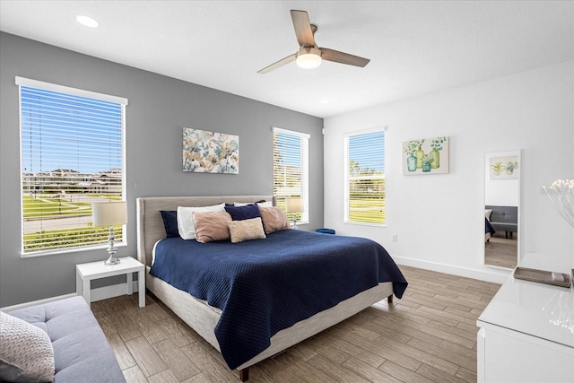 bedroom featuring ceiling fan and wood-type flooring