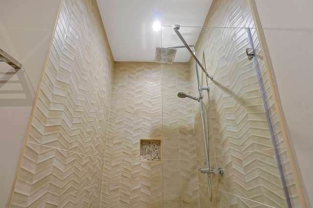 interior space with tiled shower