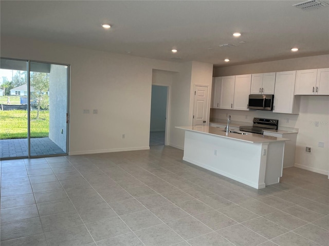 kitchen with light tile patterned floors, visible vents, recessed lighting, light countertops, and appliances with stainless steel finishes