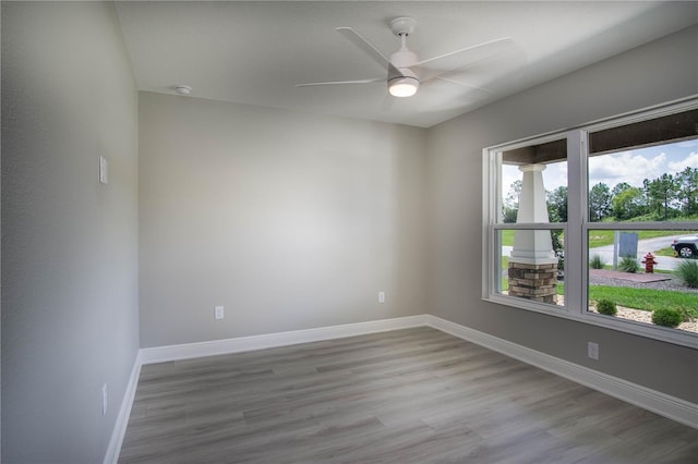 empty room with light hardwood / wood-style floors and ceiling fan