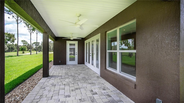 view of terrace featuring french doors and ceiling fan