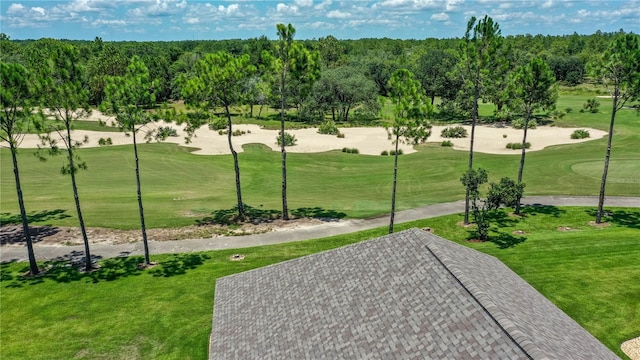 view of home's community featuring a lawn