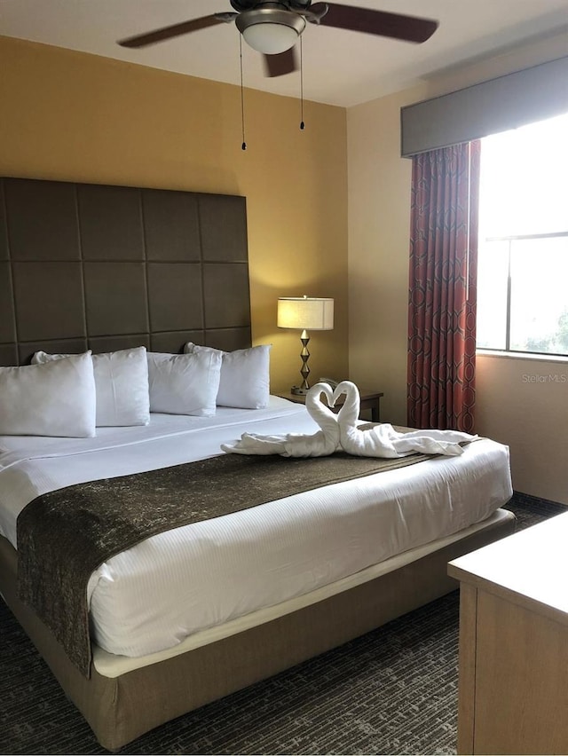 12521 Floridays Resort Dr Unit 302F, Orlando, FL 32821 - bedroom featuring ceiling fan