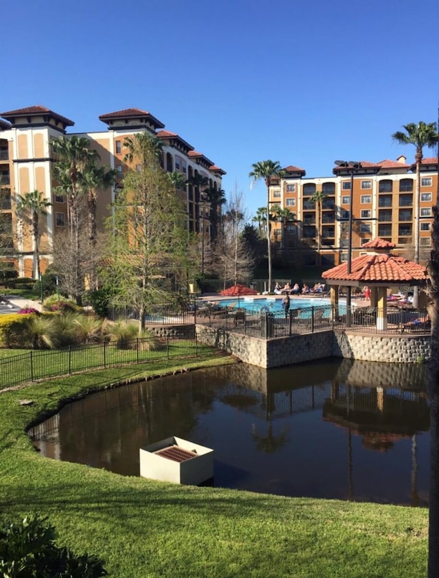 12521 Floridays Resort Dr Unit 302F, Orlando, FL 32821 - dock featuring a gazebo and a water view