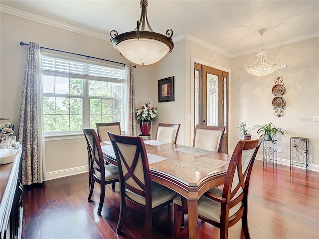 dining area featuring dark hardwood / wood-style floors and ornamental molding