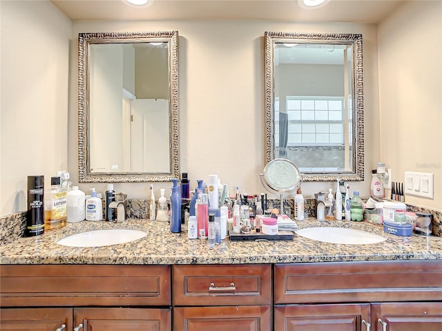 bathroom with large vanity and double sink